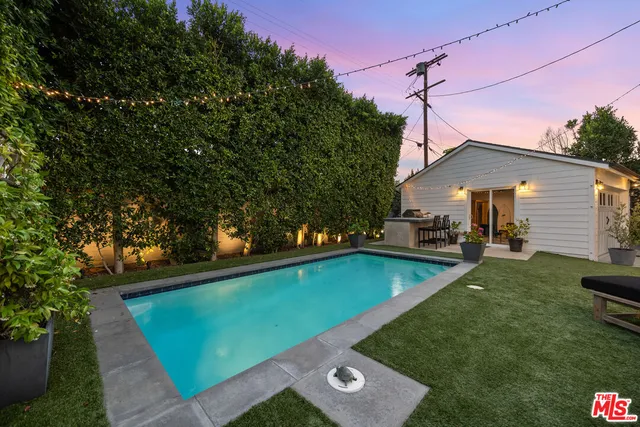 a view of a swimming pool with a lounge chairs