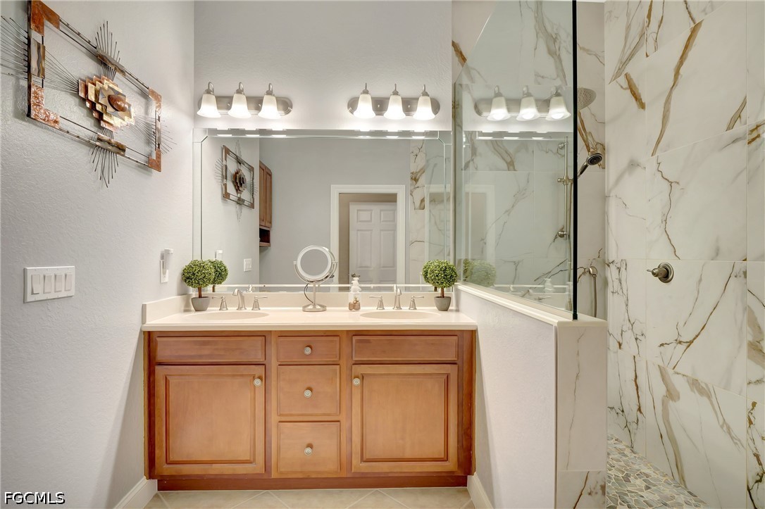 11230 Suffield Street Fort Myers, FL 33913 - Photo 16 of 42 a bathroom with a double vanity sink mirror and