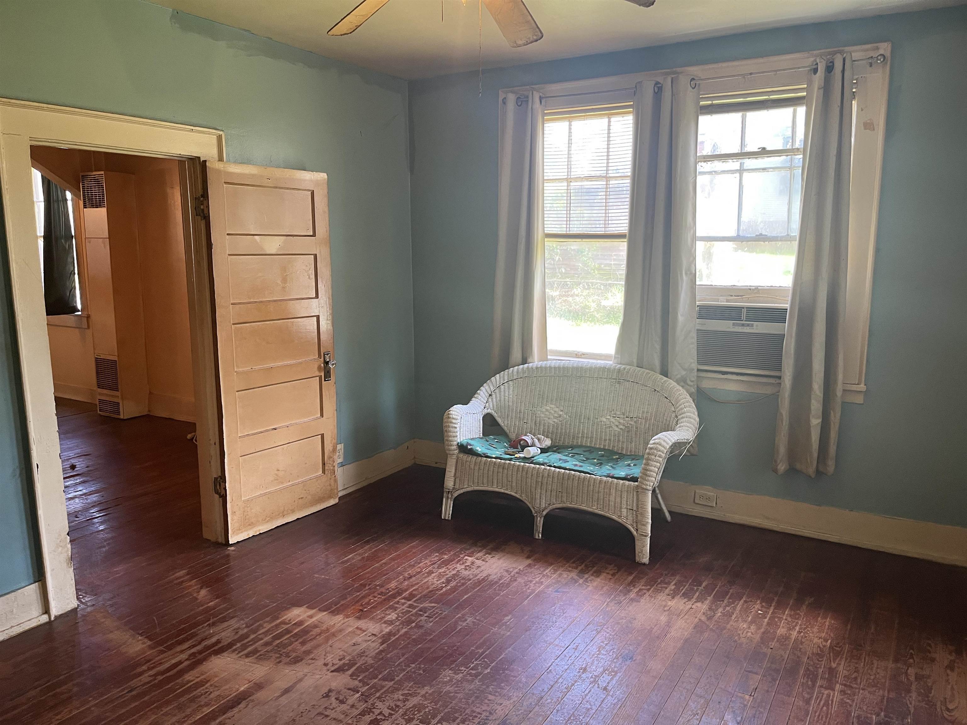 211 4th Street Mobile, AL 36611 - Photo 13 of 34 Sitting room with dark wood finished floors and ceiling fan