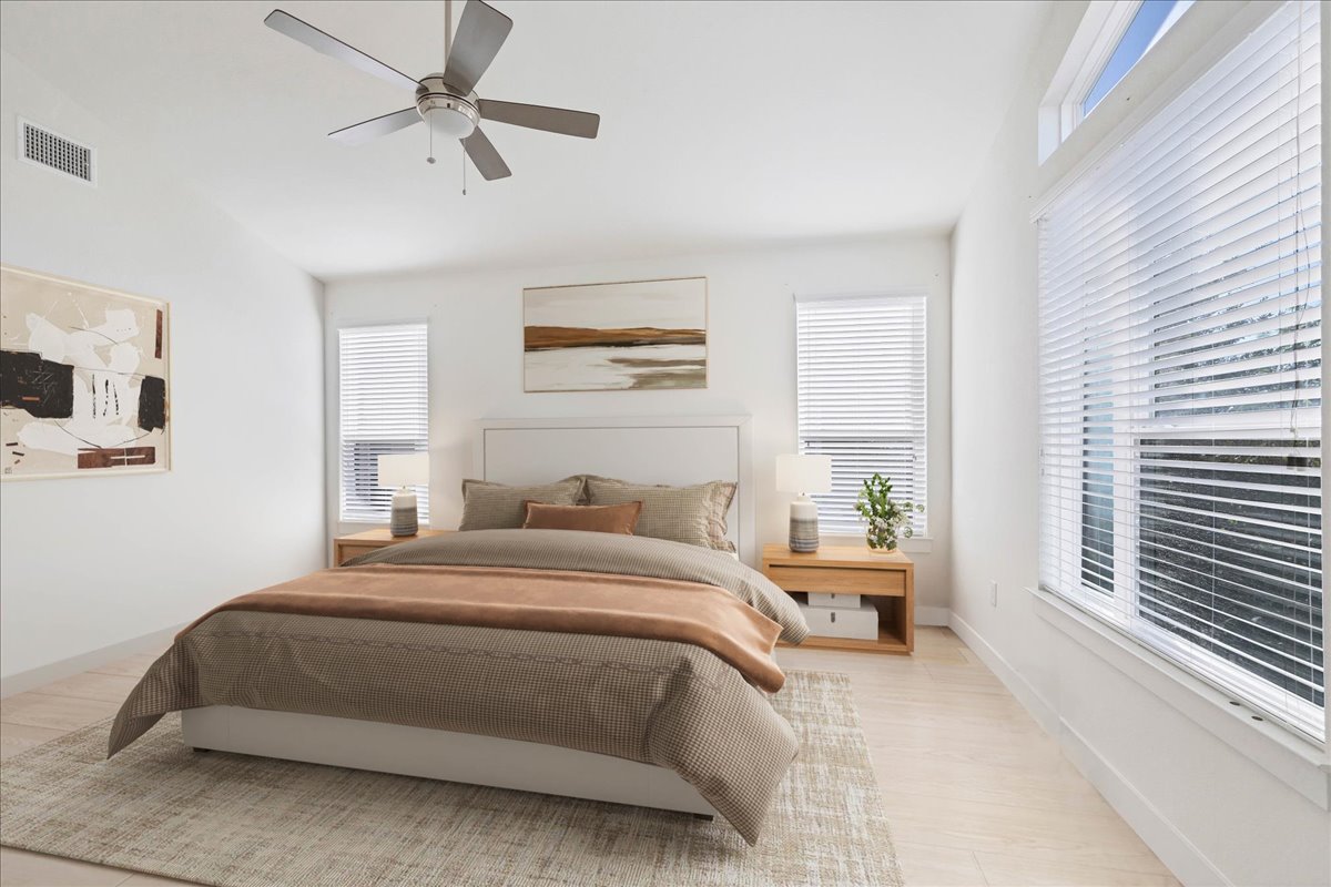 8922 Manchaca Road, Unit 906 Austin, TX 78748 - Photo 2 of 29 a bedroom with a large bed and a window