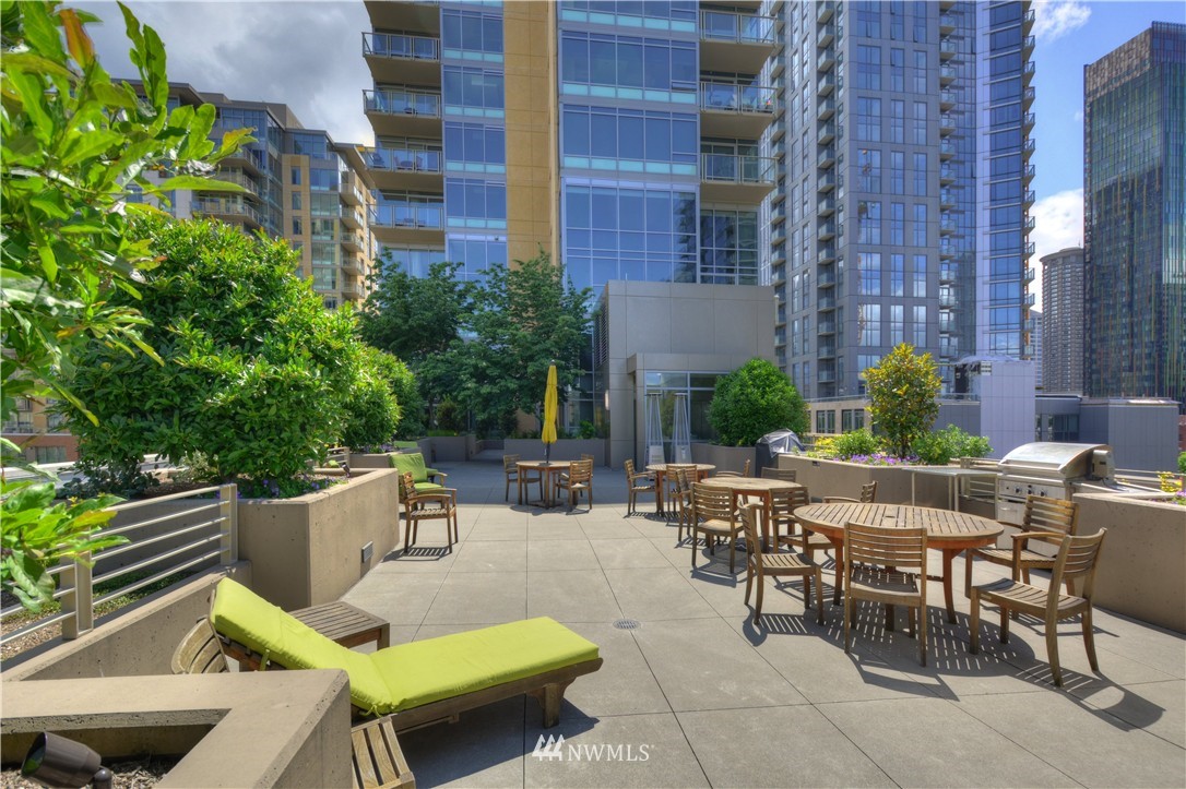 900 Lenora Street, Unit W1105 Seattle, WA 98121 - Photo 20 of 25 a view of backyard with outdoor seating and plants