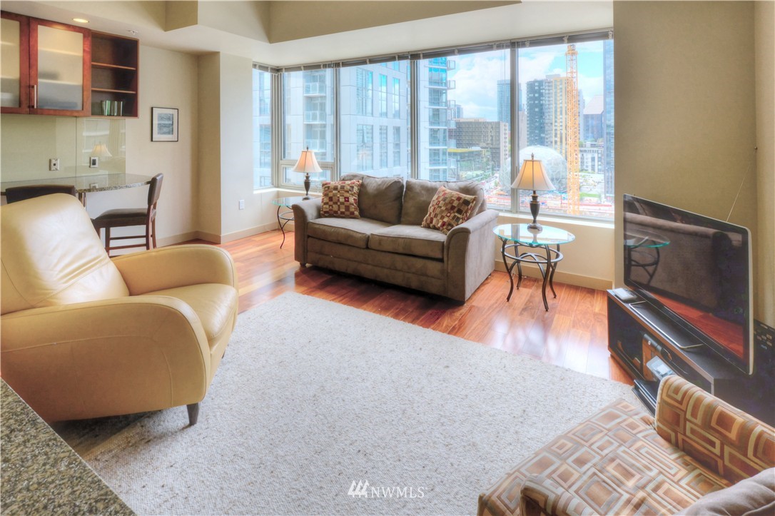 900 Lenora Street, Unit W1105 Seattle, WA 98121 - Photo 10 of 25 a living room with furniture and a fireplace