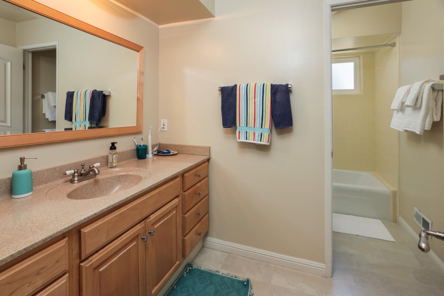 285 Ridgeway Road Woodside, CA 94062 - Photo 17 of 18 a bathroom with a sink and a mirror