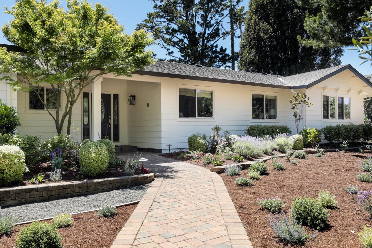 285 Ridgeway Road Woodside, CA 94062 - Photo 2 of 18 a front view of a house with a yard