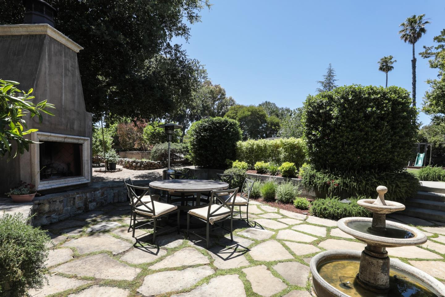 285 Ridgeway Road Woodside, CA 94062 - Photo 5 of 18 a view of a backyard with sitting area
