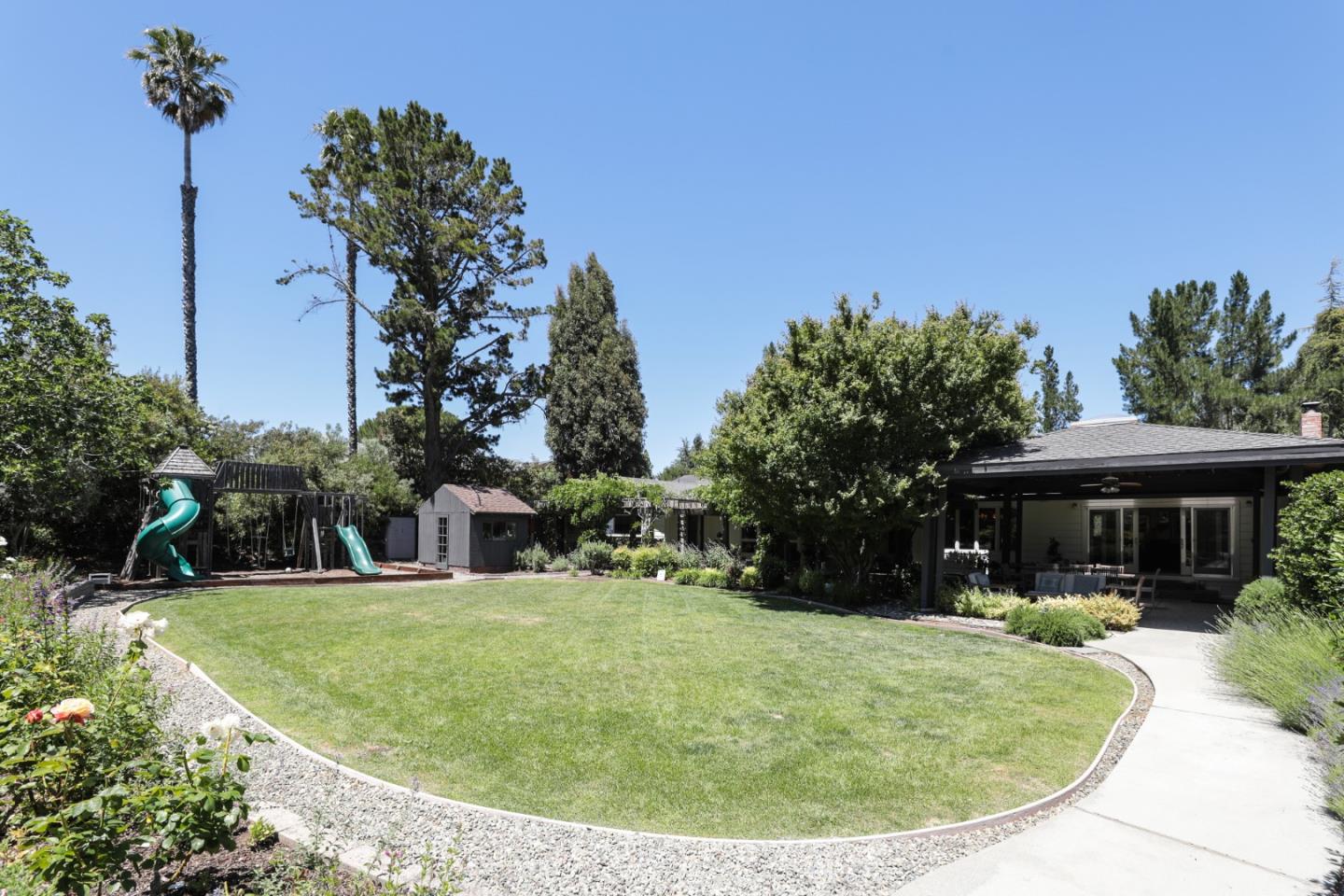 285 Ridgeway Road Woodside, CA 94062 - Photo 6 of 18 a view of a house with a yard
