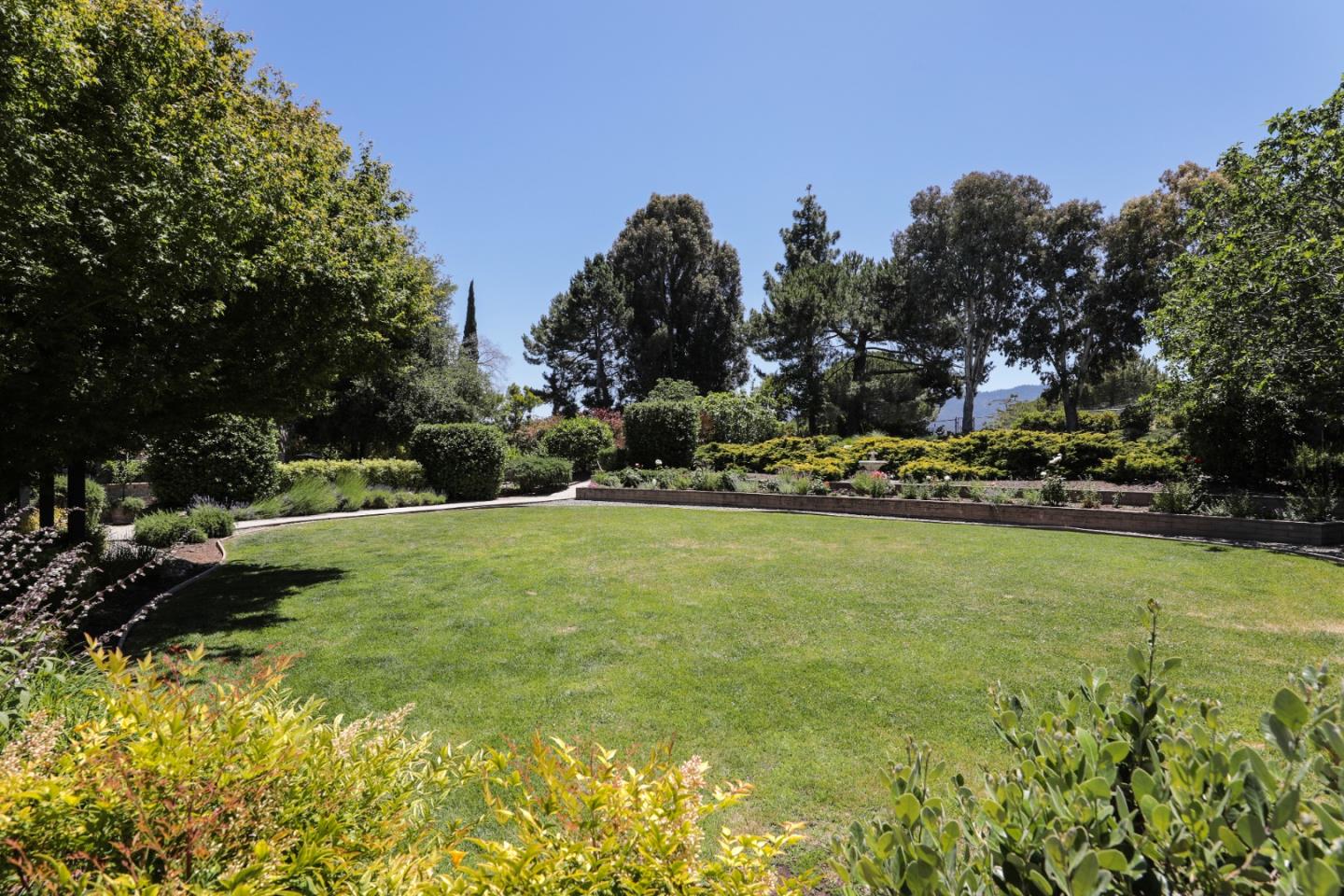 285 Ridgeway Road Woodside, CA 94062 - Photo 7 of 18 a view of a swimming pool and outdoor space