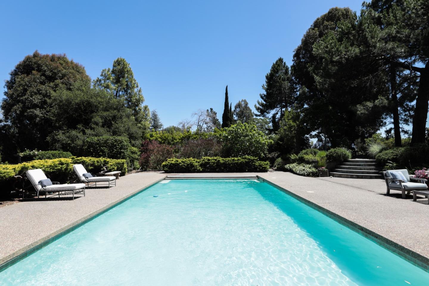 285 Ridgeway Road Woodside, CA 94062 - Photo 8 of 18 a view of a backyard with swimming pool