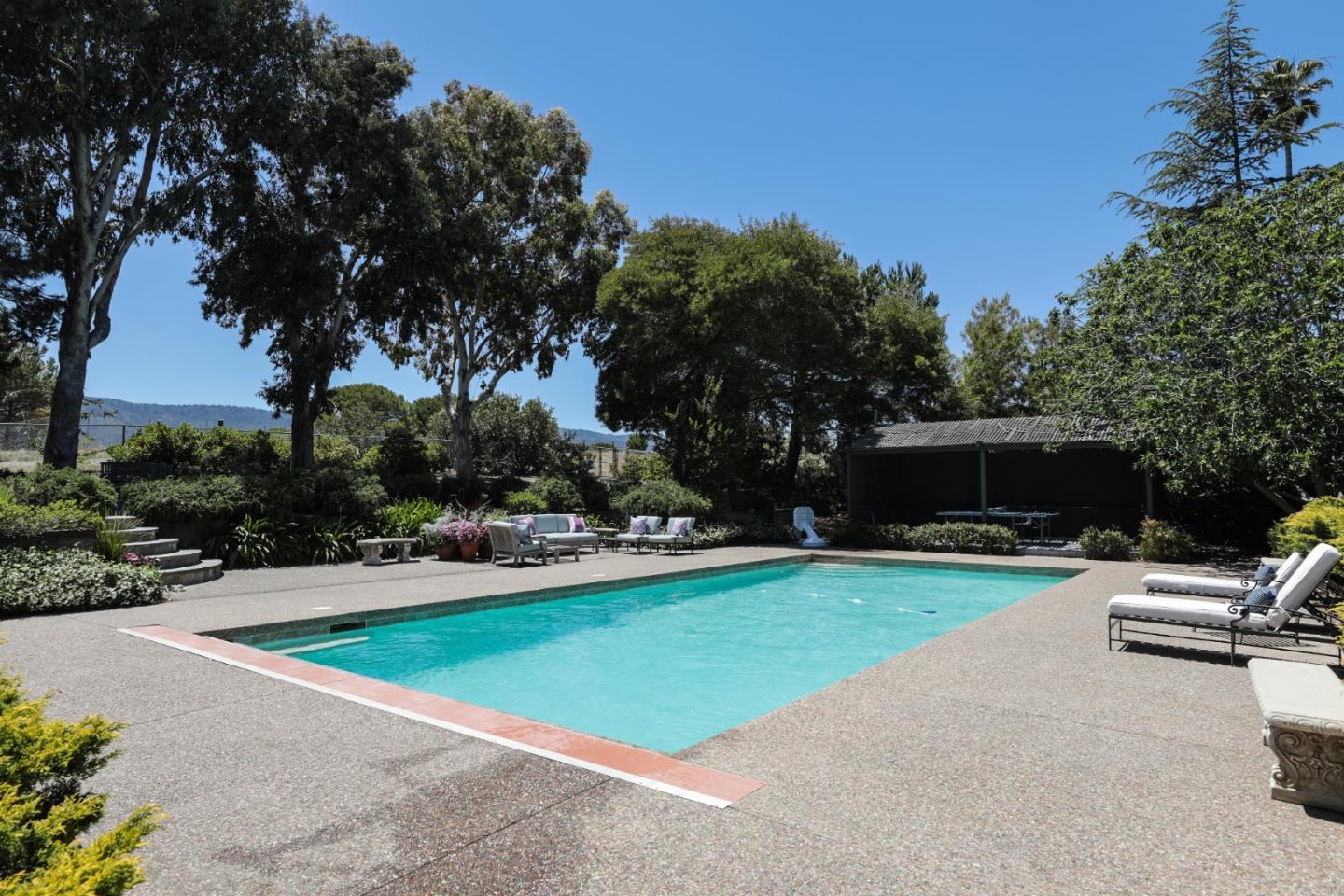 285 Ridgeway Road Woodside, CA 94062 - Photo 9 of 18 a view of a backyard with a slide