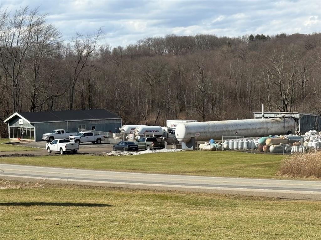 7700 Sharon-Mercer Road Mercer, PA 16137 - Photo 11 of 14 a view of a lake with houses