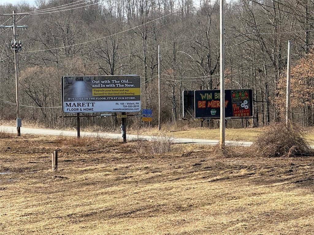 7700 Sharon-Mercer Road Mercer, PA 16137 - Photo 13 of 14 a view of a brick house with a small yard