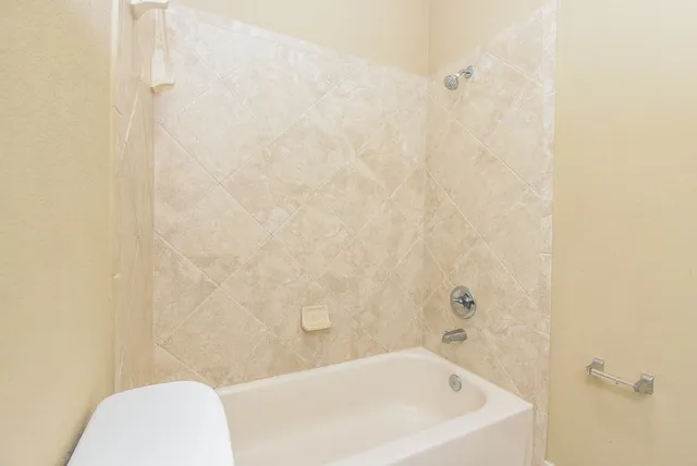 a bathroom with a white bath tub