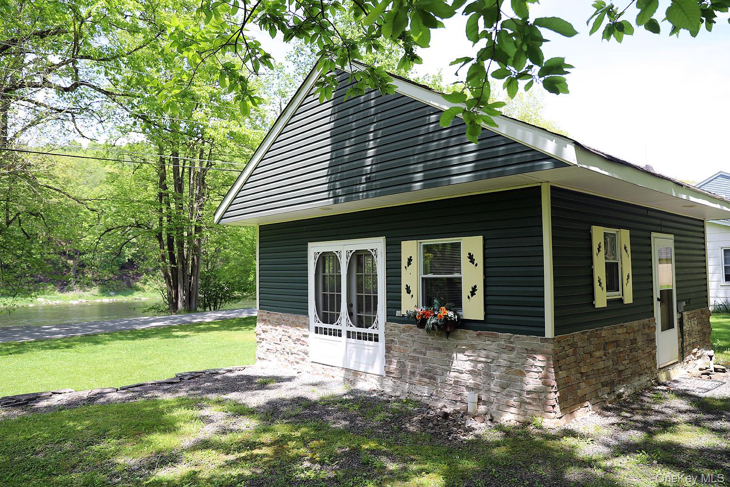 860 River Road Callicoon, NY 12723 - Photo 28 of 45 a view of a house with a yard