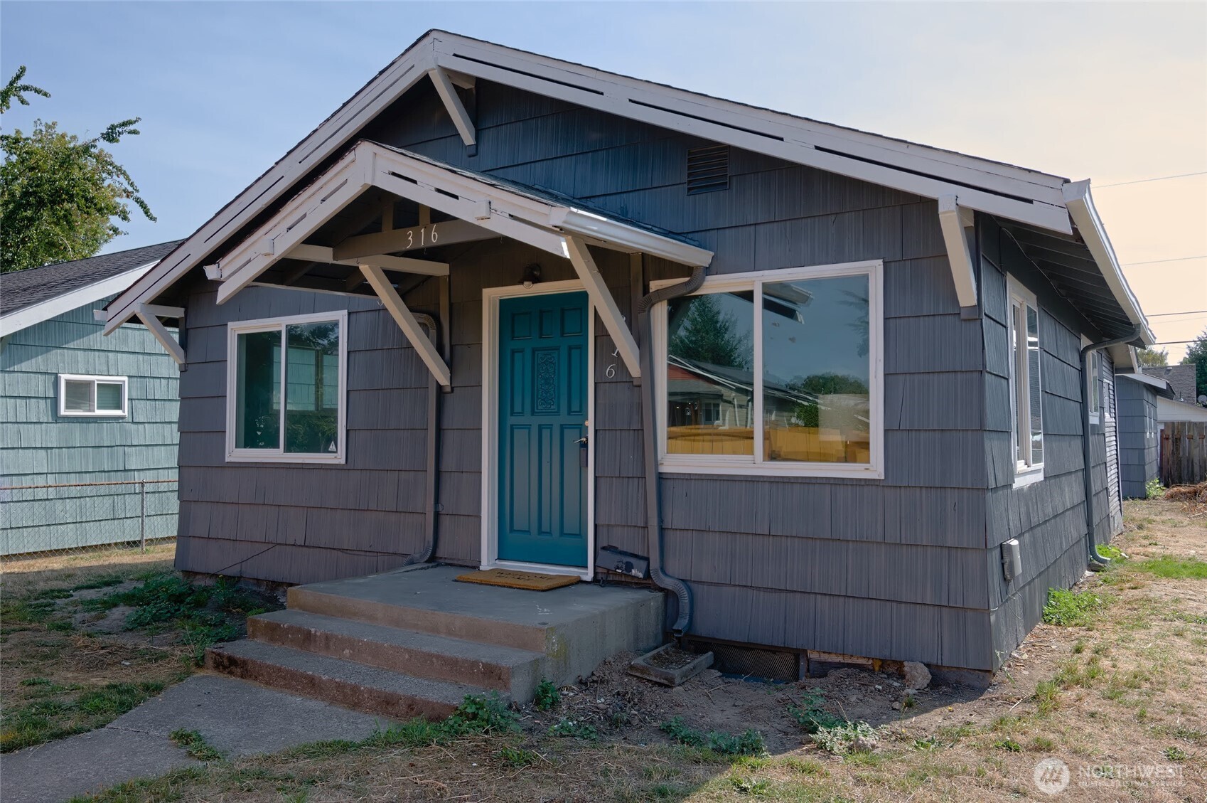 316 16th Avenue Longview, WA 98632 - Photo 1 of 19 a front view of a house with garden
