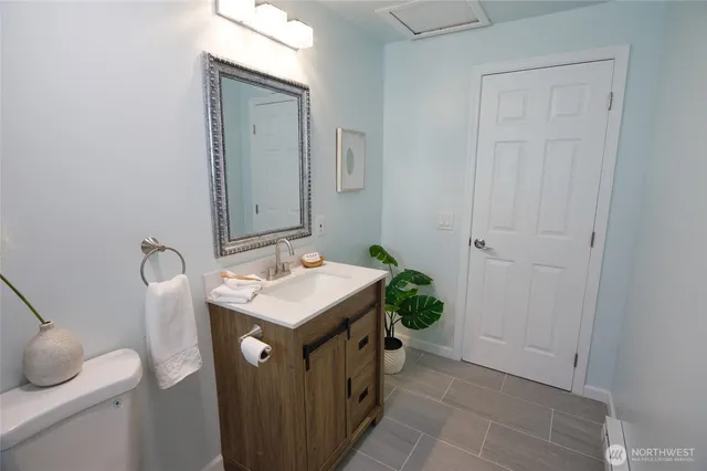 a utility room with a sink dryer and washer