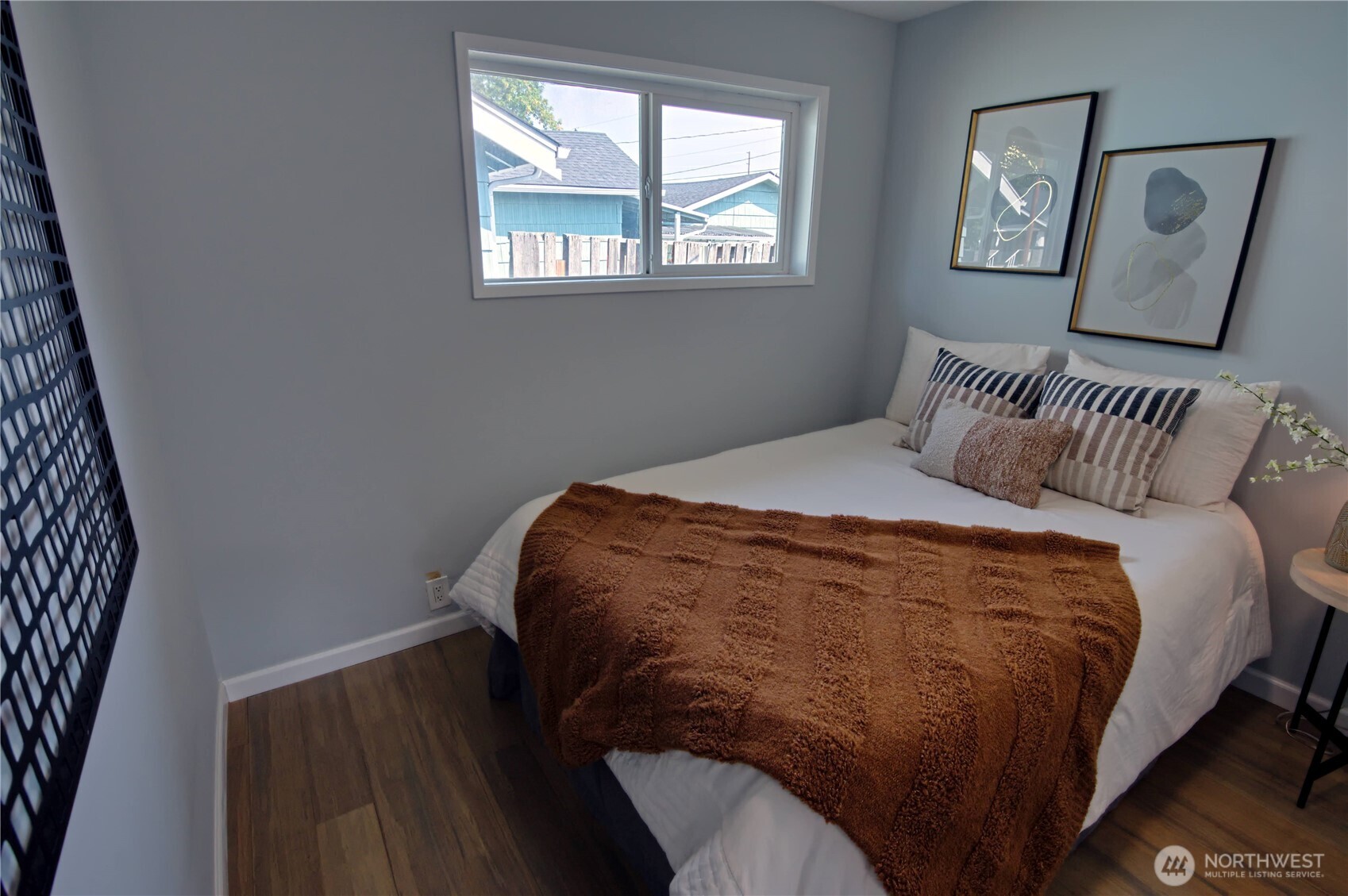 316 16th Avenue Longview, WA 98632 - Photo 9 of 19 a bedroom with a bed and a window