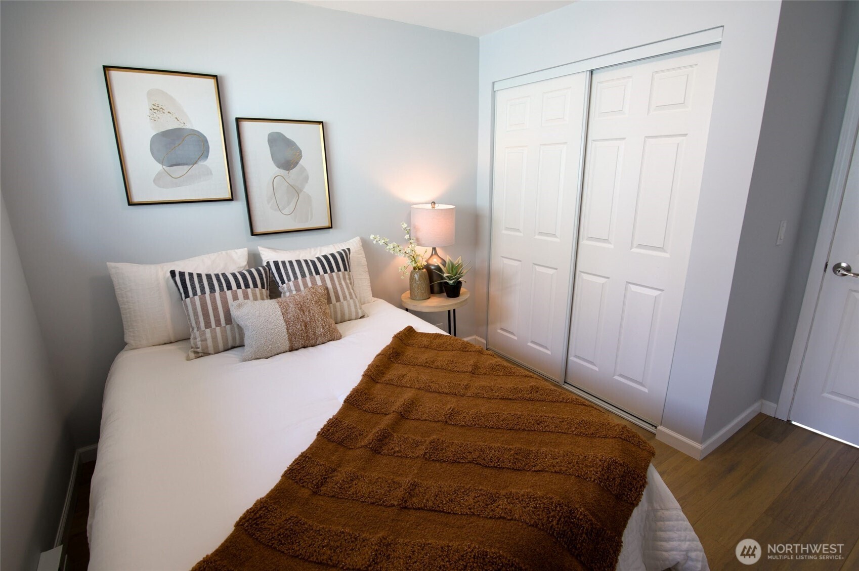 316 16th Avenue Longview, WA 98632 - Photo 10 of 19 a bedroom with a bed and painting on the wall