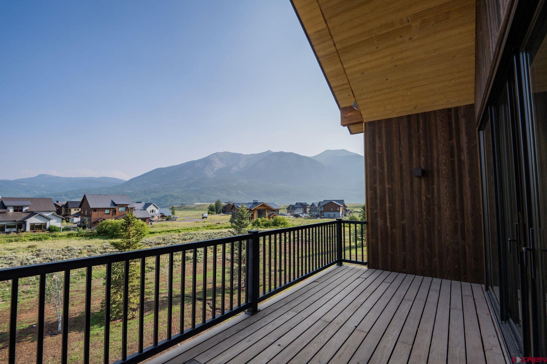 180 Elk Valley Road, Unit 109 Crested Butte, CO 81224 - Photo 16 of 36 a view of balcony with wooden floor and city view
