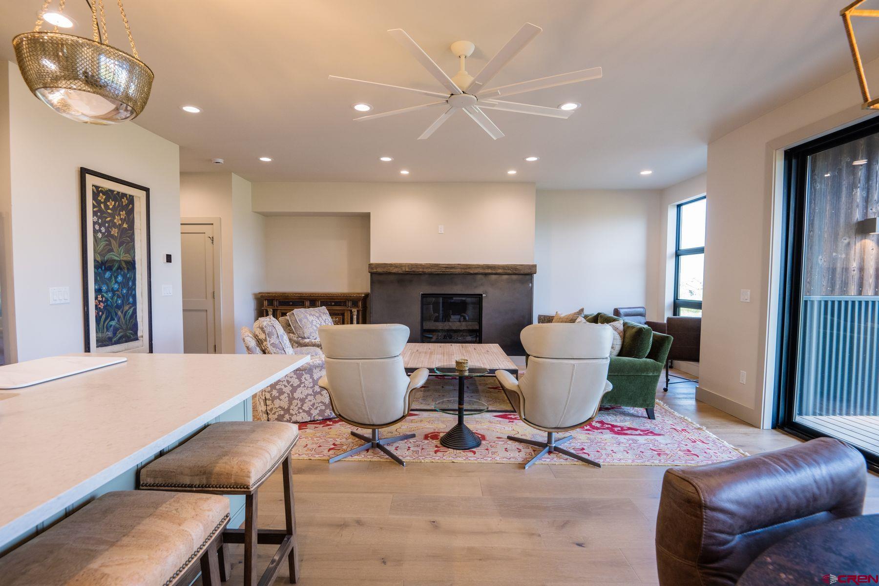 180 Elk Valley Road, Unit 109 Crested Butte, CO 81224 - Photo 7 of 36 a living room with furniture and a fireplace