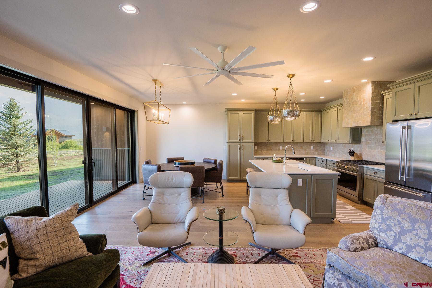 180 Elk Valley Road, Unit 109 Crested Butte, CO 81224 - Photo 8 of 36 a living room with furniture and a large window