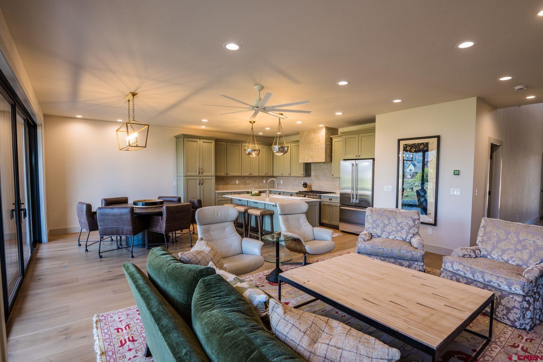 180 Elk Valley Road, Unit 109 Crested Butte, CO 81224 - Photo 9 of 36 a living room with lots of furniture and view of kitchen