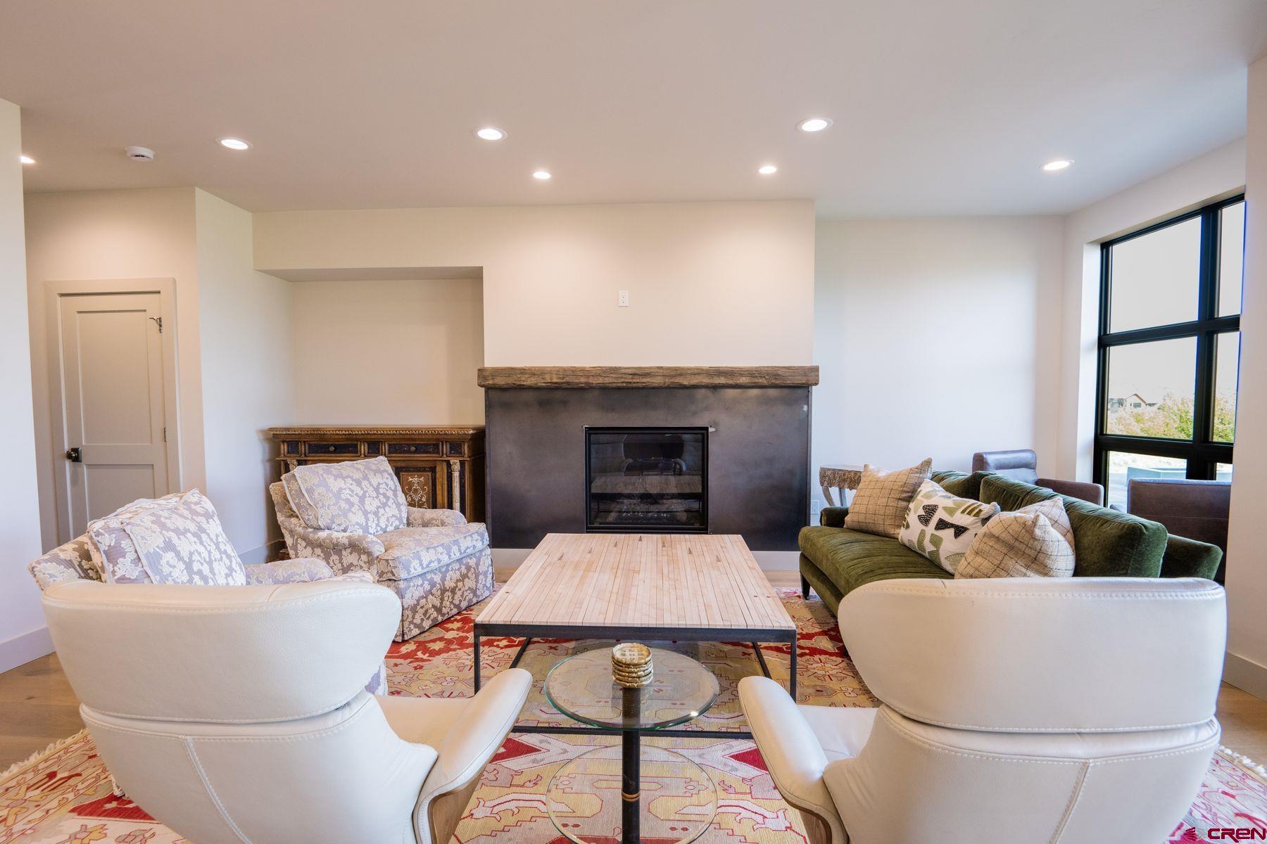 180 Elk Valley Road, Unit 109 Crested Butte, CO 81224 - Photo 10 of 36 a living room with furniture and a fireplace