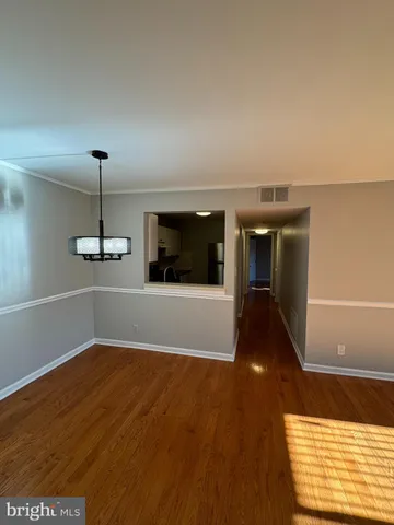 a view of a room with window wooden floor and windows