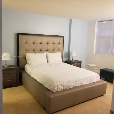 a bathroom with double sink and a mirror