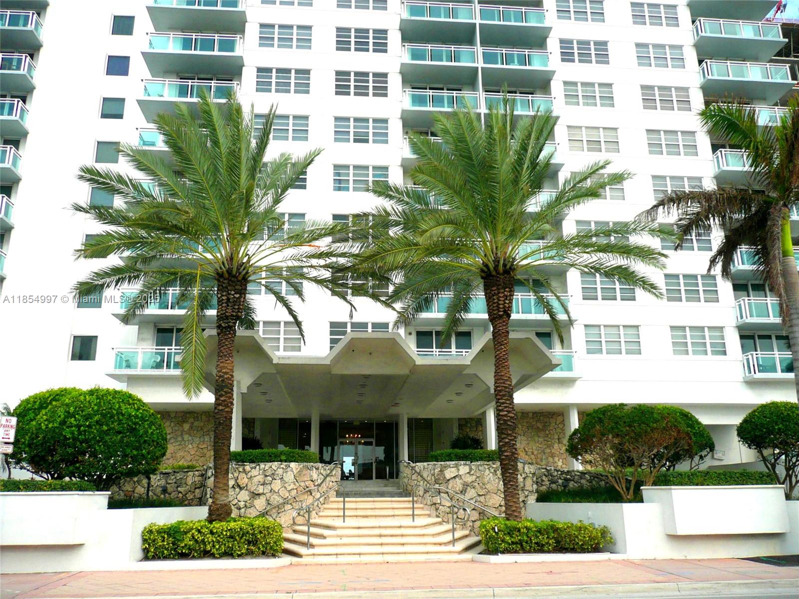 6917 Collins Avenue, Unit 408 Miami Beach, FL 33141 - Photo 23 of 39 a front view of a building with garden
