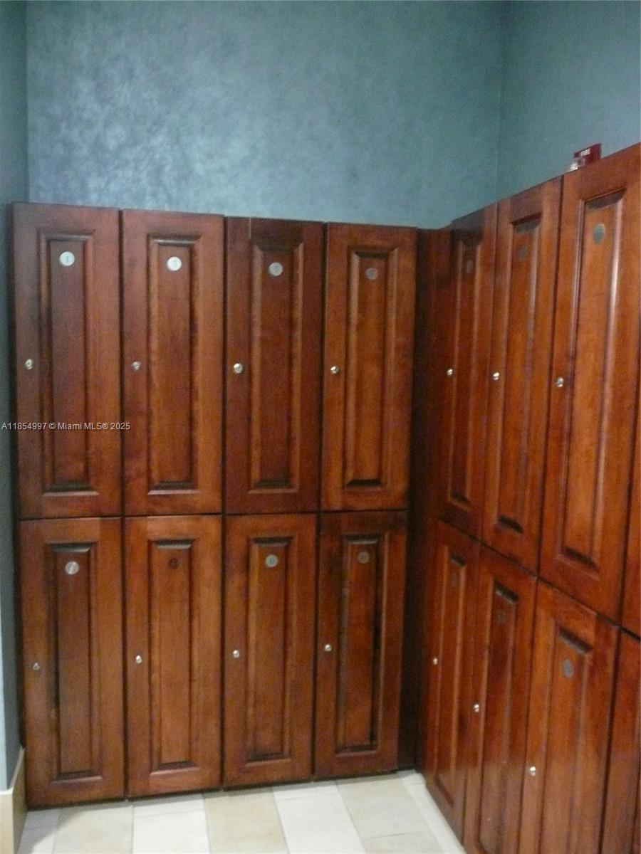 6917 Collins Avenue, Unit 408 Miami Beach, FL 33141 - Photo 25 of 39 a view of a room with wooden walls