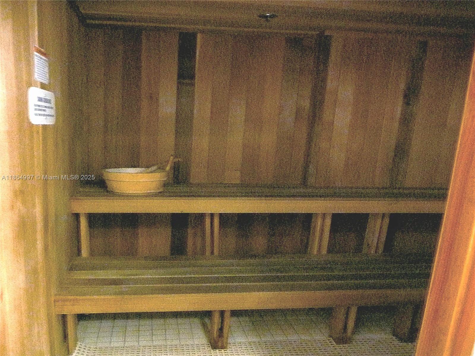 6917 Collins Avenue, Unit 408 Miami Beach, FL 33141 - Photo 26 of 39 a bathroom with a sink and a mirror