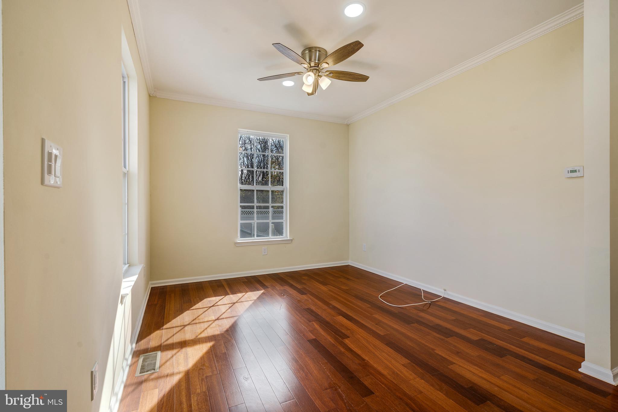 23 Homestead Drive Pemberton, NJ 08068 - Photo 20 of 40 wooden floor in an empty room with a window