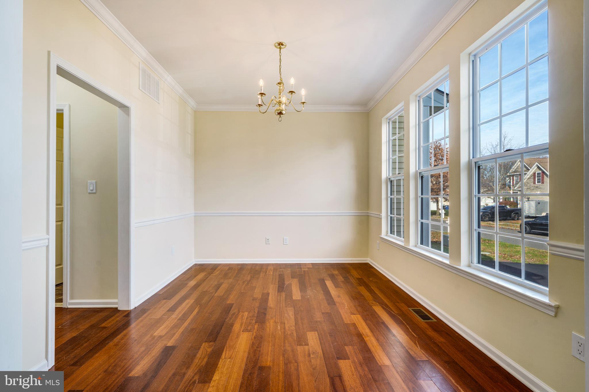 23 Homestead Drive Pemberton, NJ 08068 - Photo 21 of 40 a view of empty room with wooden floor and fan