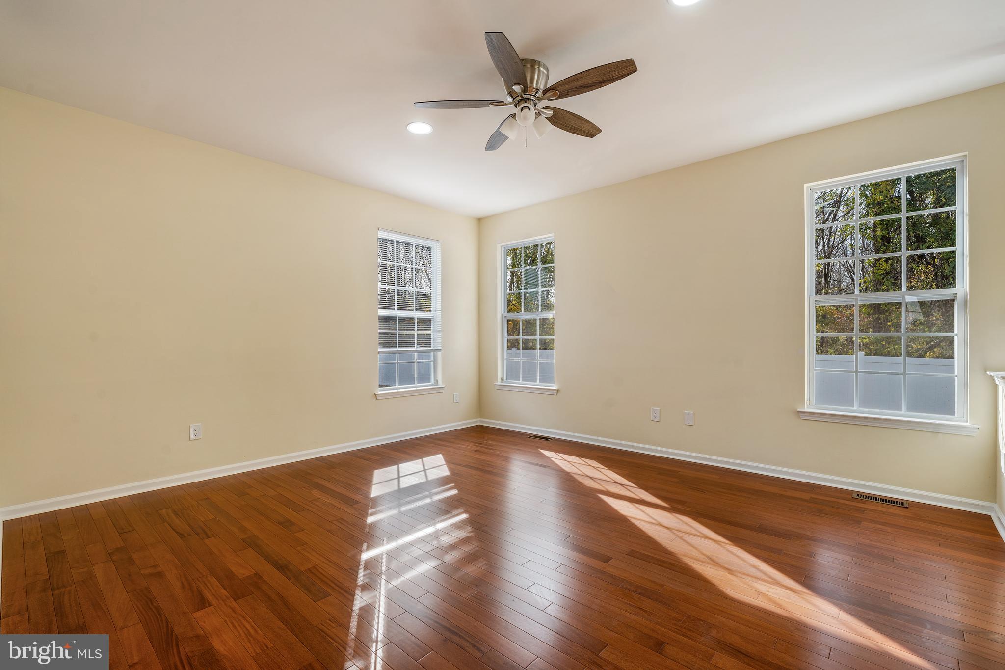 23 Homestead Drive Pemberton, NJ 08068 - Photo 22 of 40 a view of an empty room with a window and wooden floor