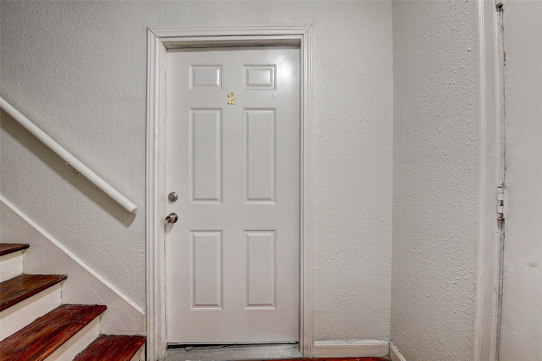 2509 Shakespeare Street, Unit 4 Houston, TX 77030 - Photo 11 of 16 a view of front door with wooden floor
