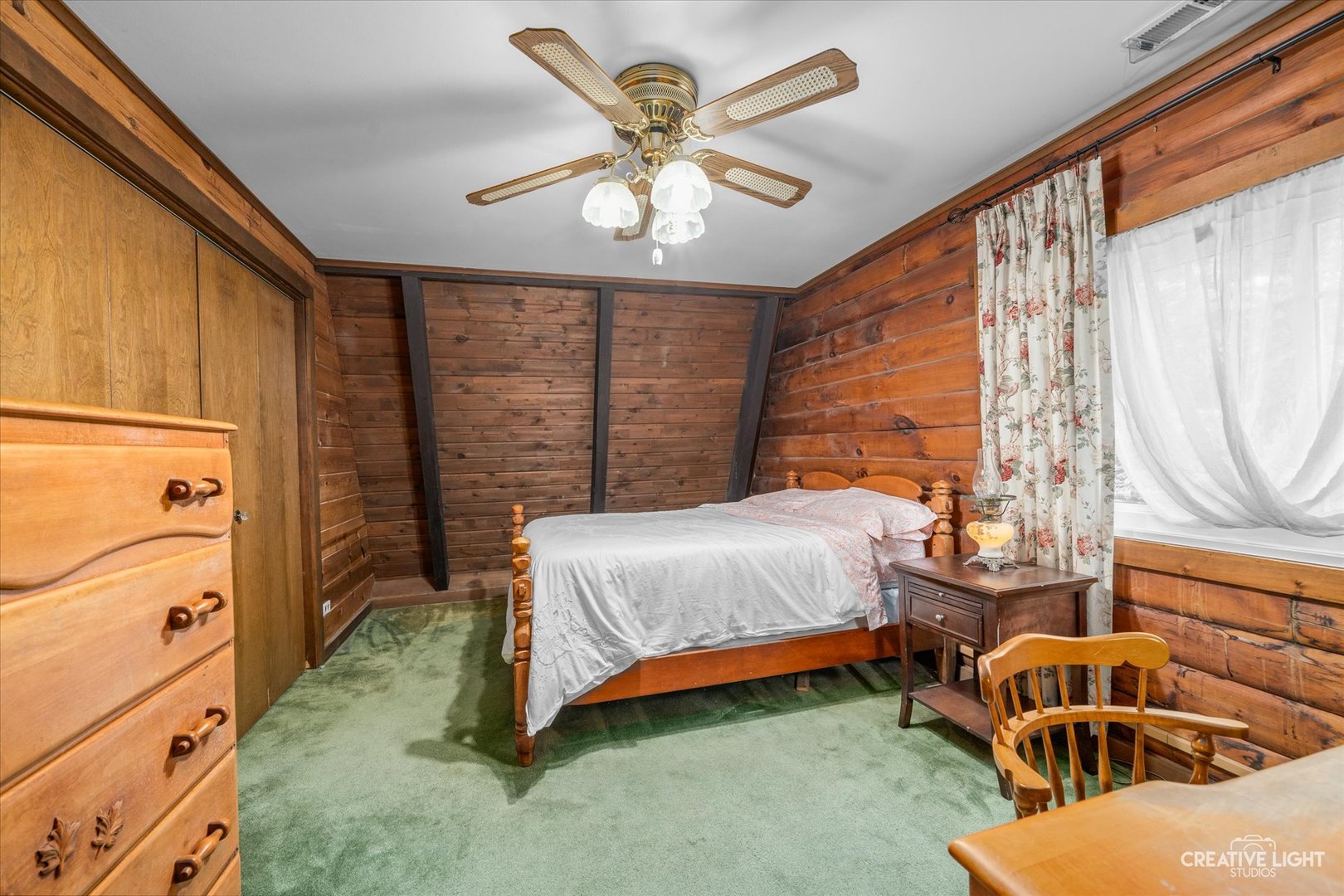 S011 County Farm Road Winfield, IL 60190 - Photo 12 of 18 a bedroom with a bed and a chandelier