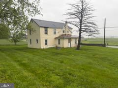 13804 Mercersburg Road Clear Spring, MD 21722 - Photo 26 of 48 a front view of a house with garden