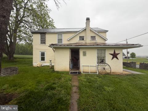 13804 Mercersburg Road Clear Spring, MD 21722 - Photo 10 of 48 a view of a white house with a yard and table and chairs