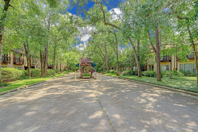 a view of a tree in front of a house