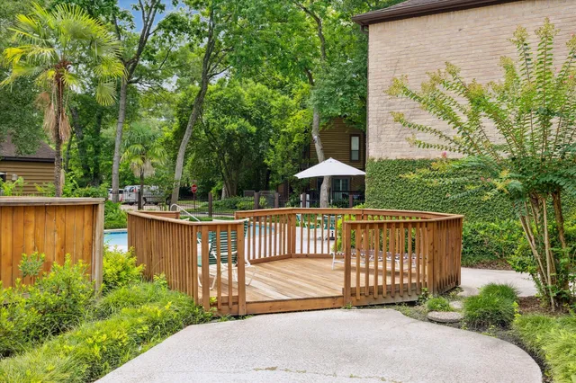 a view of a street with a fence