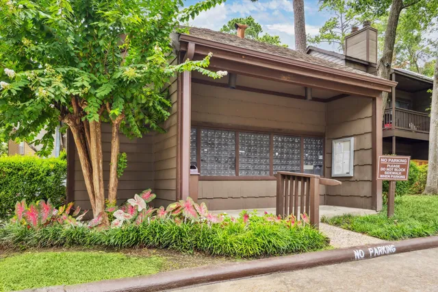 front view of house with potted plants