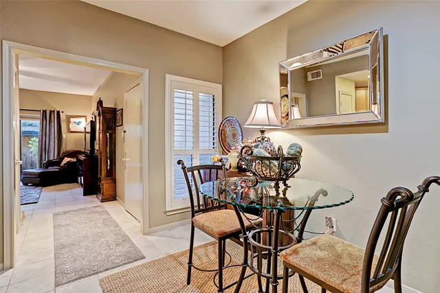 a view of a livingroom with furniture and a window