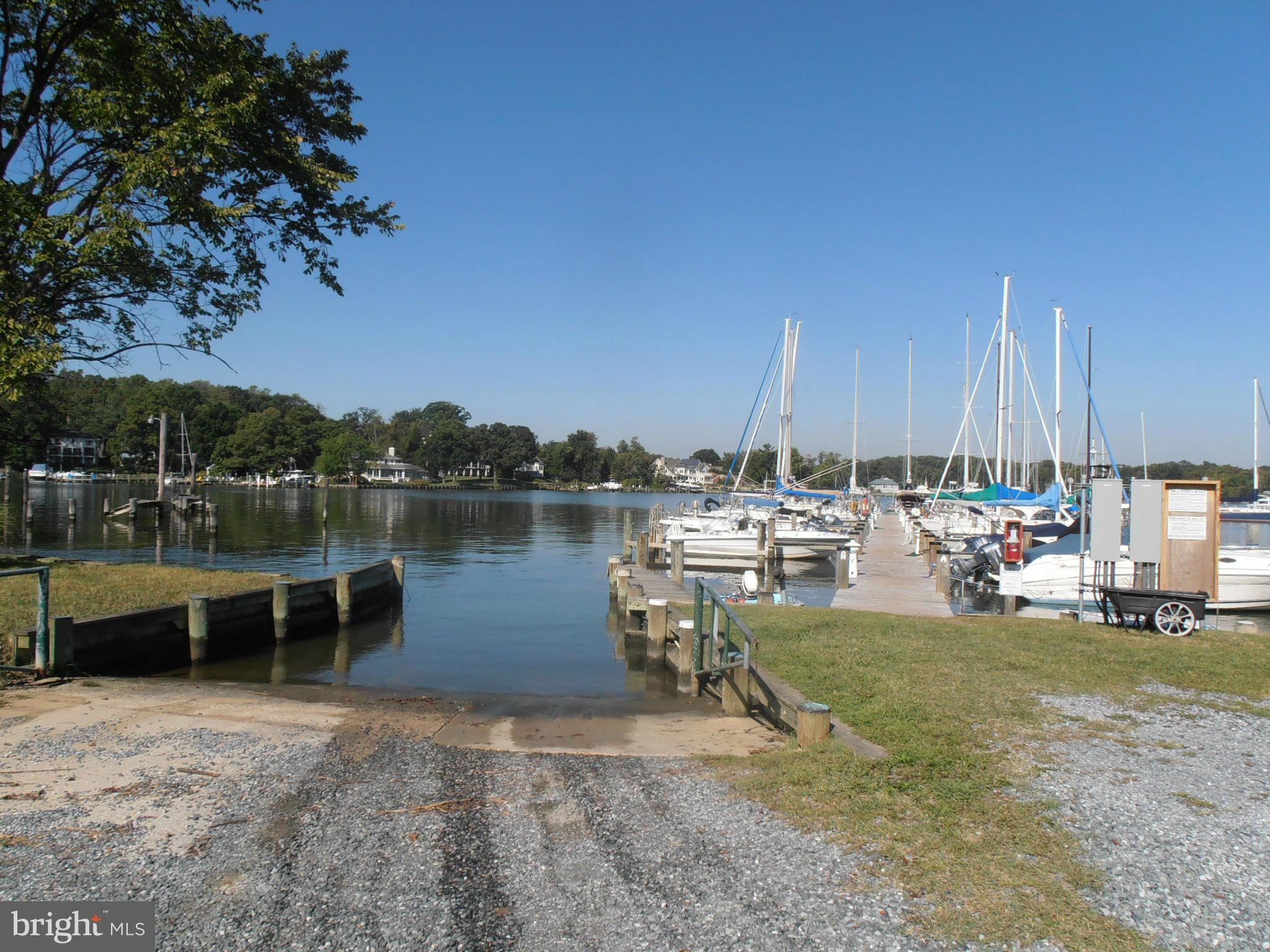7 Decatur Avenue Annapolis, MD 21403 - Photo 8 of 30 a view of a lake with a table and chairs