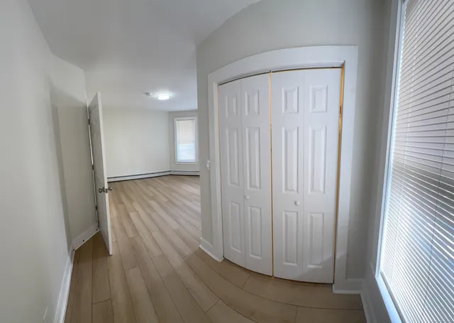 a view of entryway with wooden floor