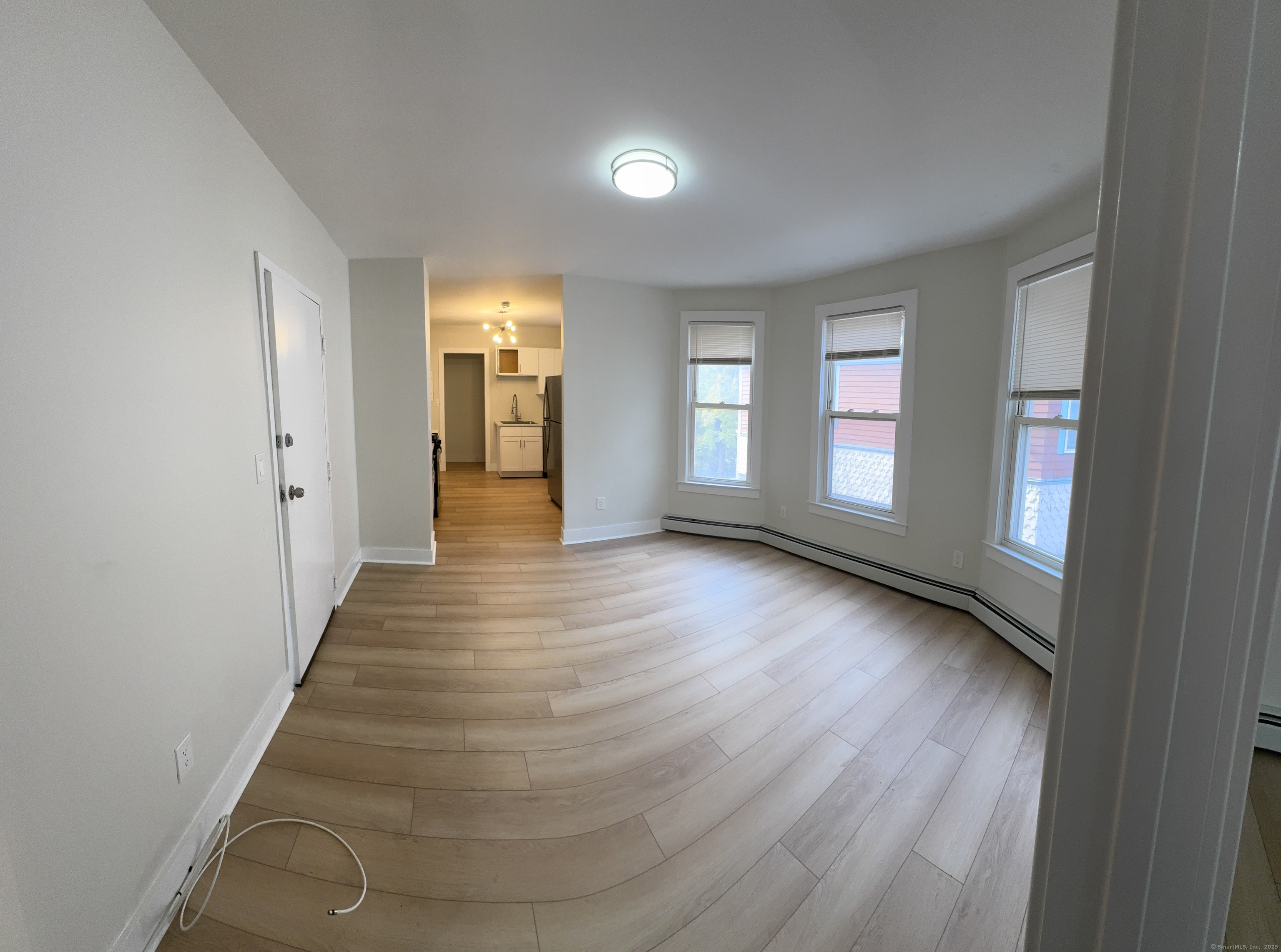 706 George Street New Haven, CT 06511 - Photo 2 of 4 a view of a hallway with wooden floor and windows