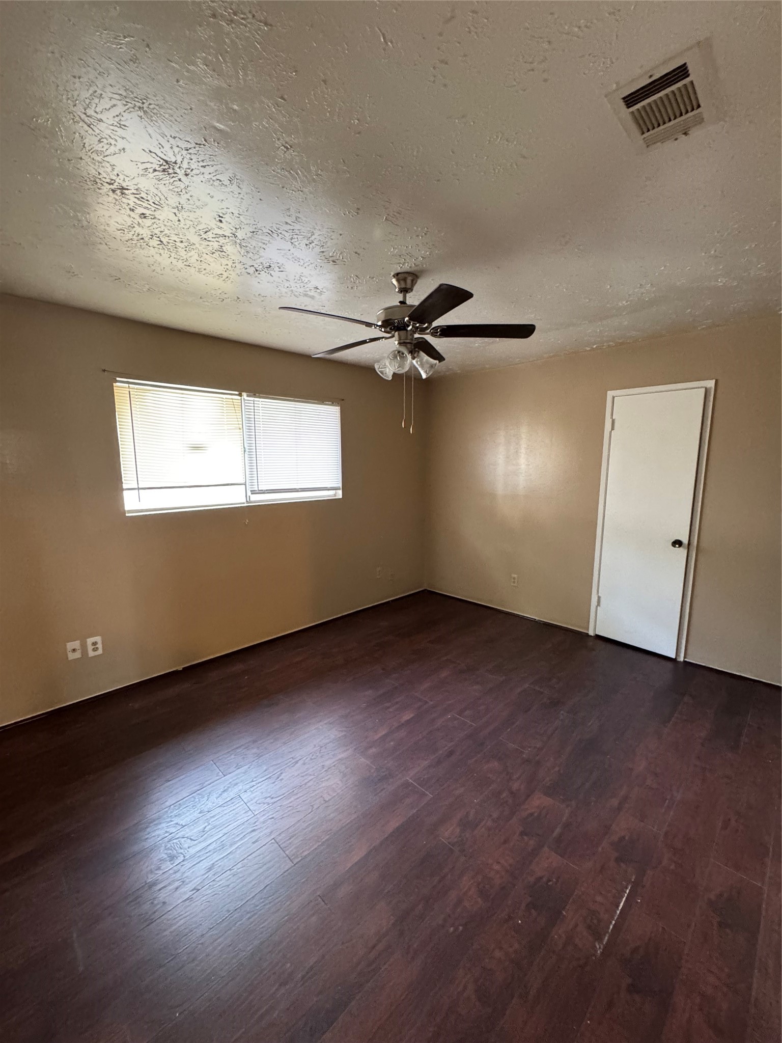4435 Brookhead Trail Houston, TX 77066 - Photo 13 of 20 an empty room with wooden floor cabinet and windows