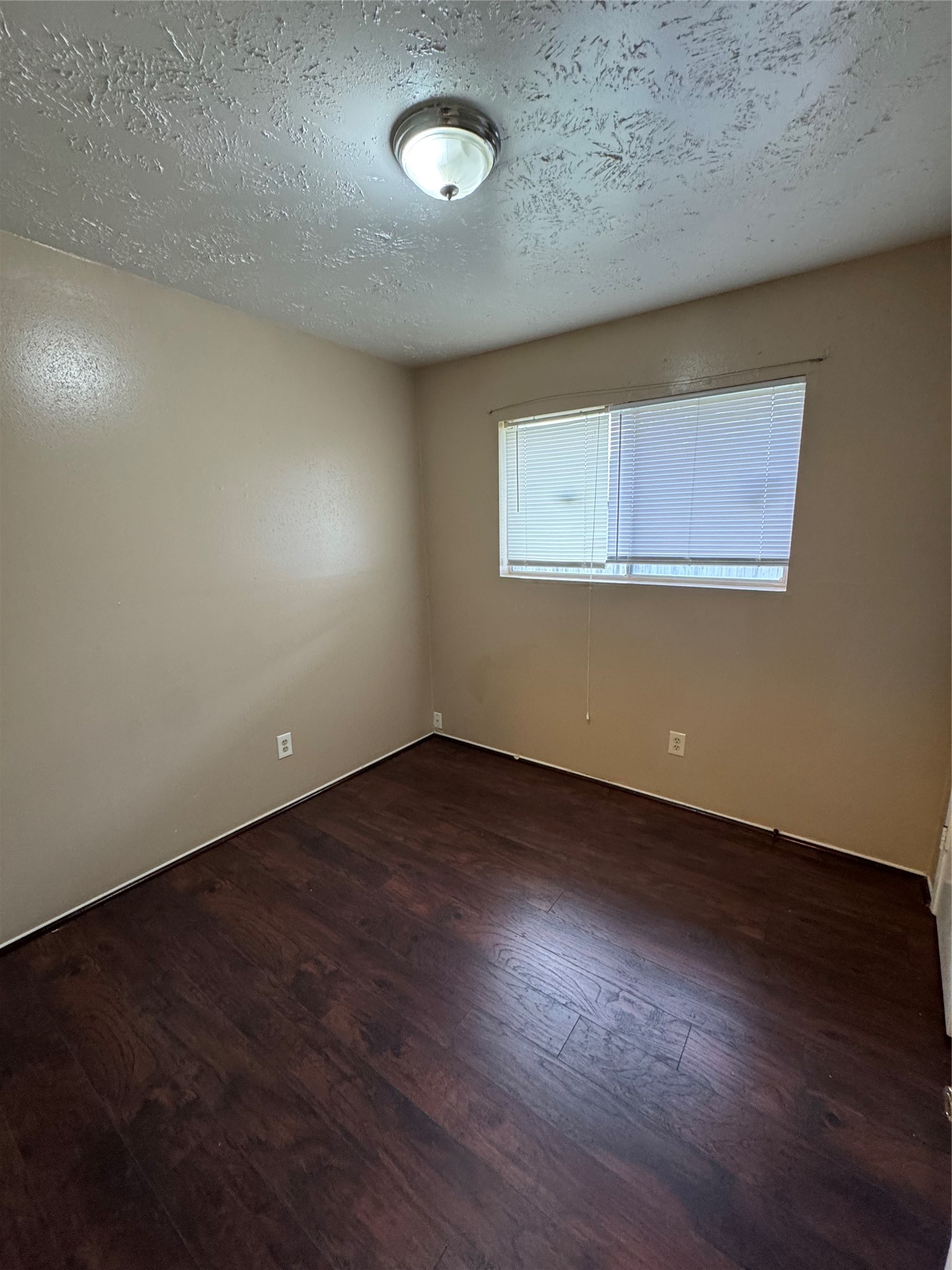 4435 Brookhead Trail Houston, TX 77066 - Photo 15 of 20 an empty room with wooden floor and windows