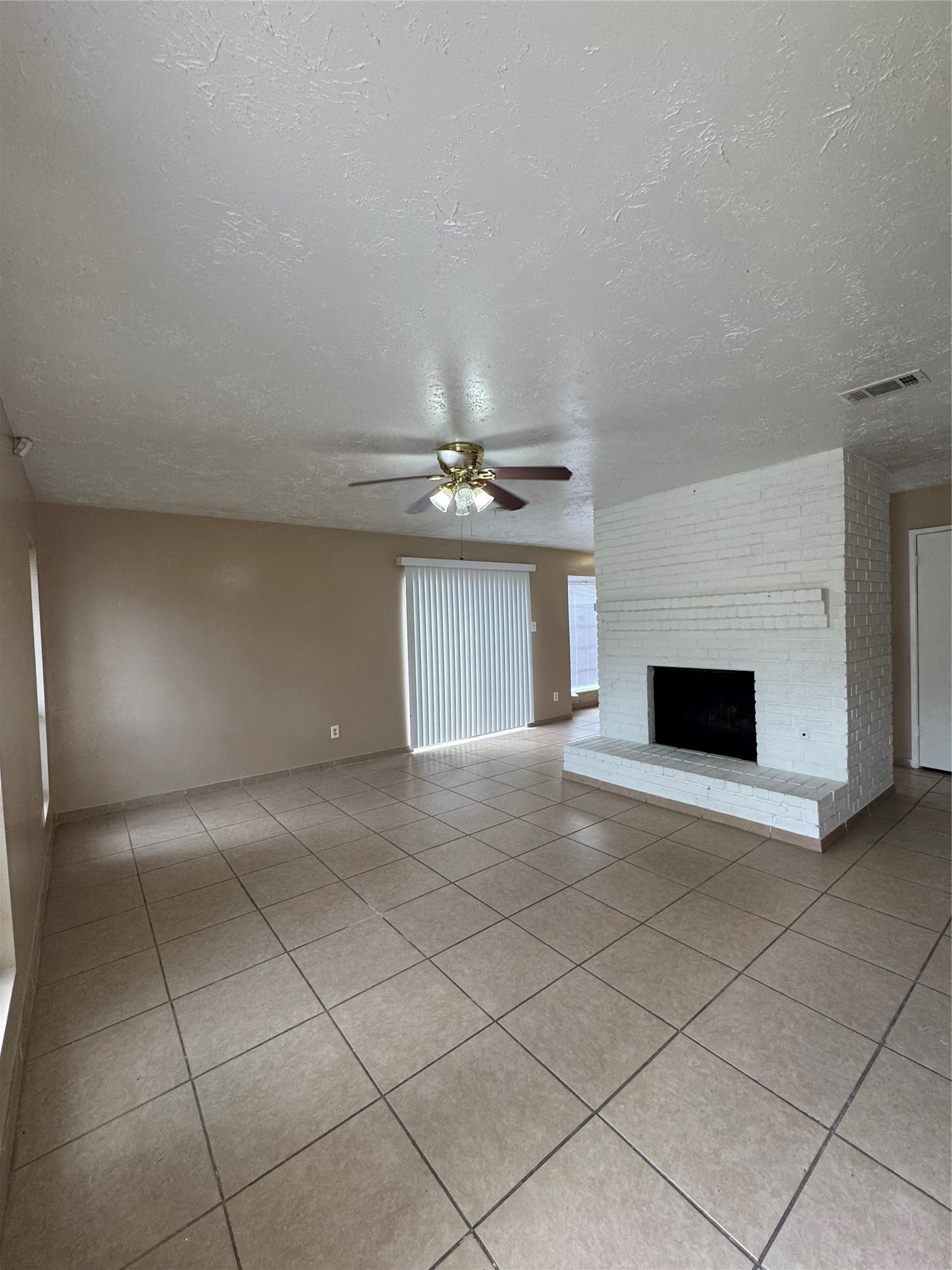 4435 Brookhead Trail Houston, TX 77066 - Photo 9 of 20 a view of an empty room with a fireplace
