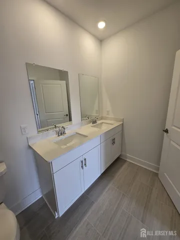 a bathroom with a shower and a toilet