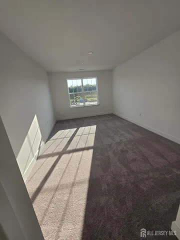 a view of a big room with dining room wooden floor and a rug